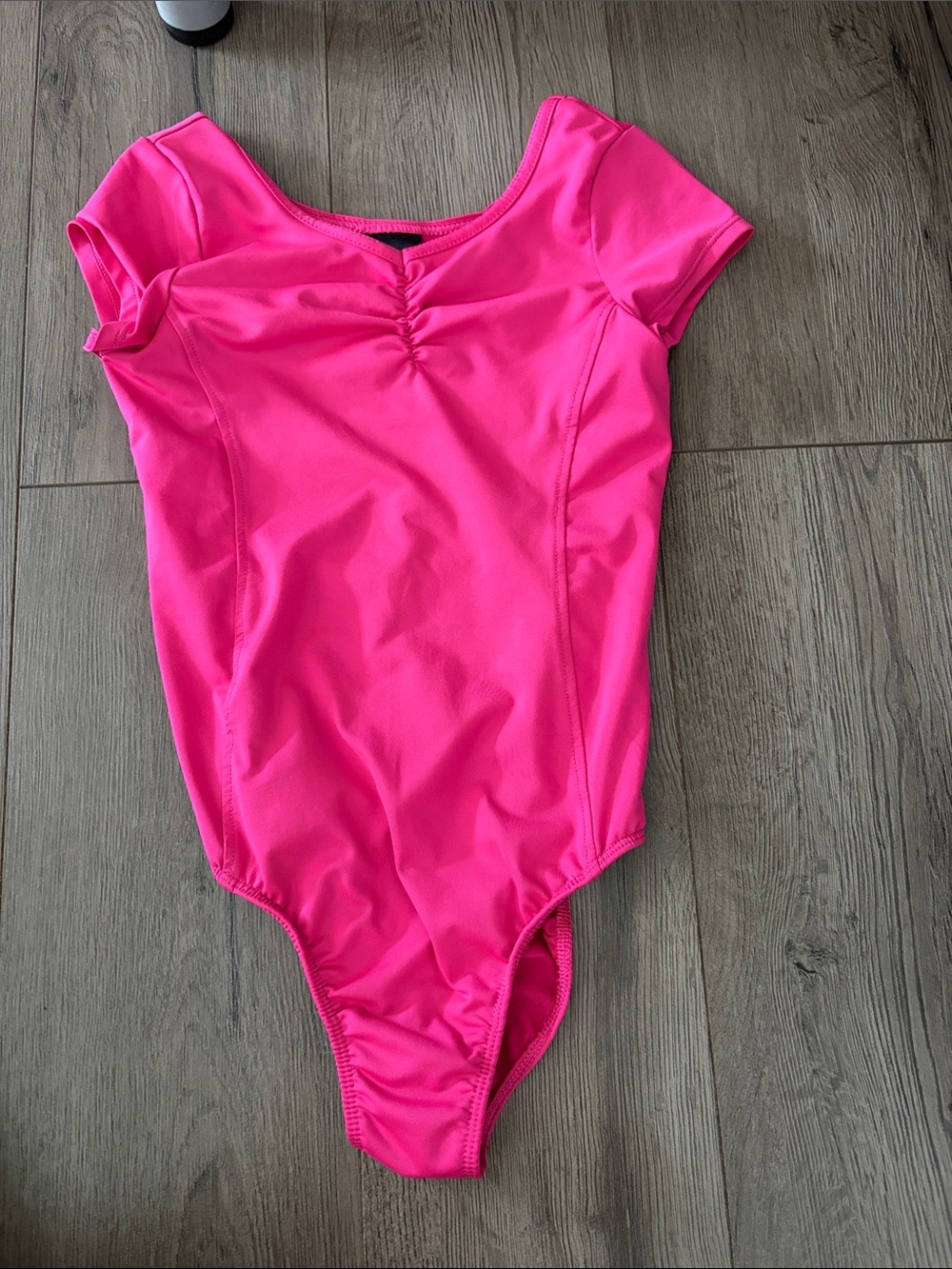 Girls Bright Pink Short Sleeve One-Piece Leotard. Girls size Medium